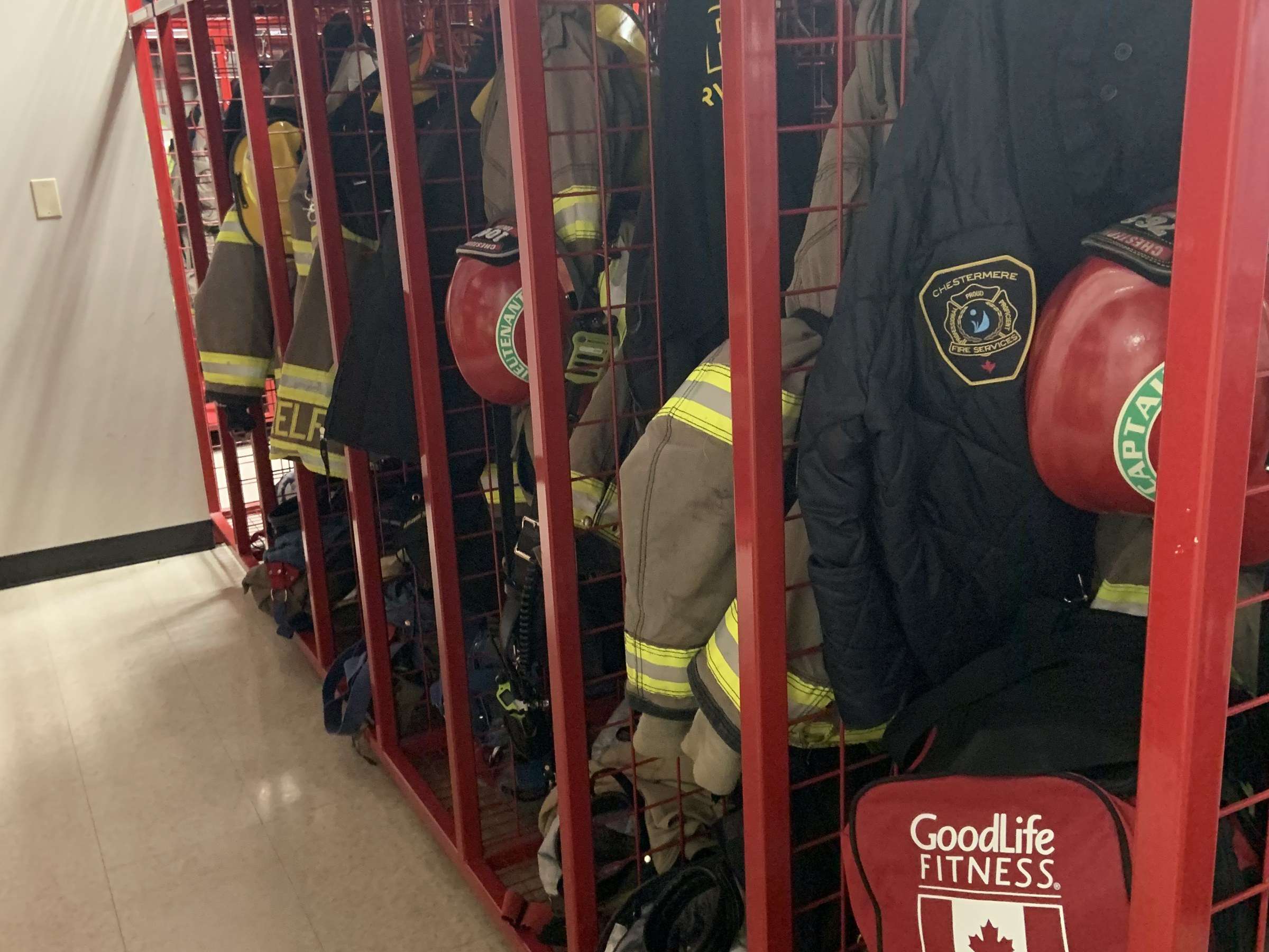 Turnout gear on red lockers in a fire station