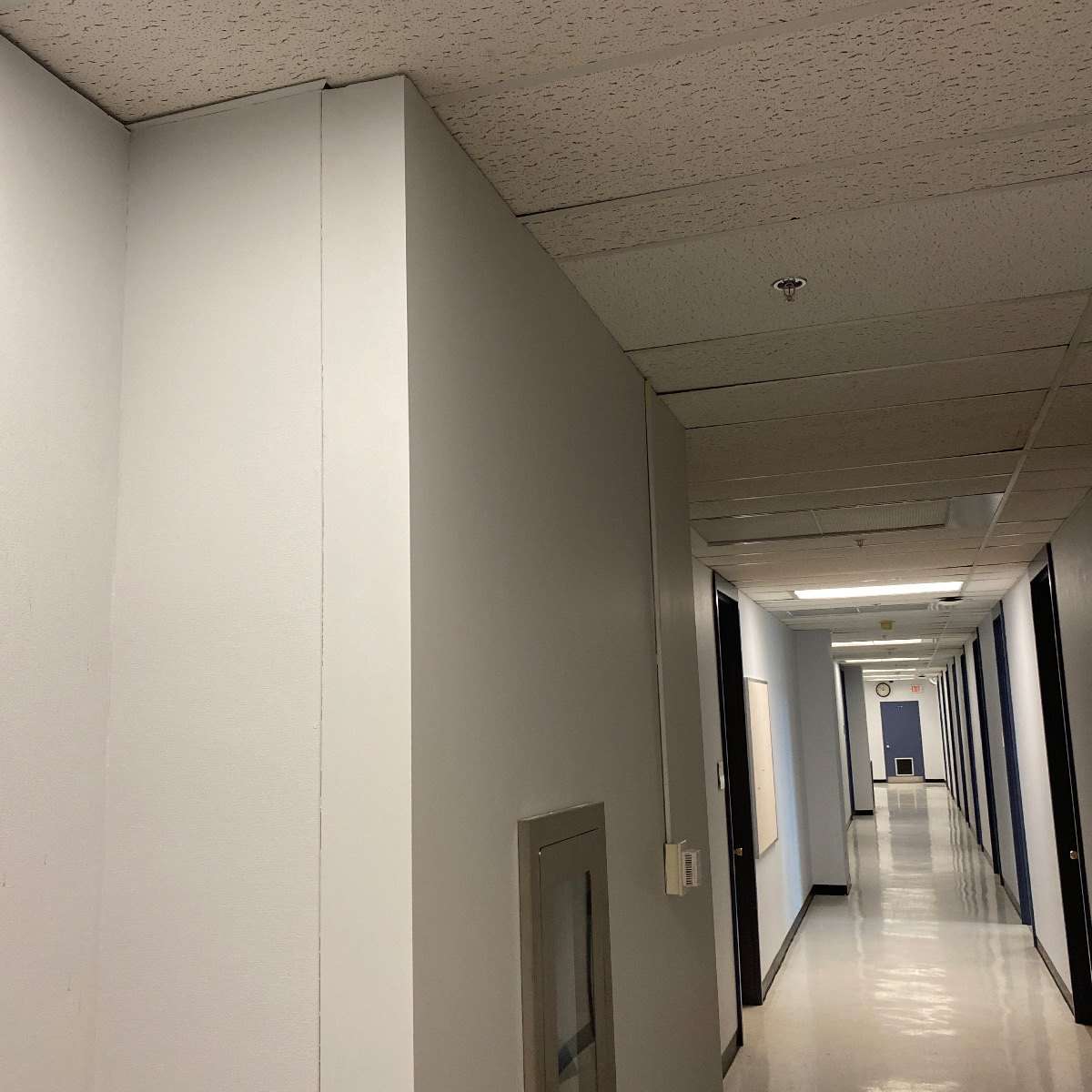 Corridor in the Social Sciences tower with a new sprinkler head
